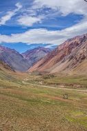 Aconcagua is a beautiful mountain with green plants in the Principal Cordillera of the Andes mountain range in Argentina