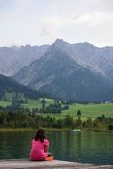 girl on the lake in the mountains of tyrol