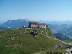 hut on a green alpine mountain