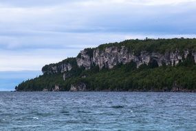view from the lake to the rocky coast
