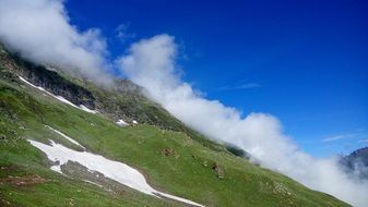 fog over a hiking trail in the mountains
