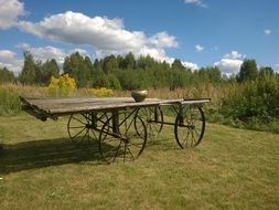 cauldron stands on a wooden cart