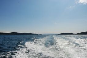 White Foamy trace on water in sea