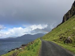 Hillside road with colorful plants in Scotland