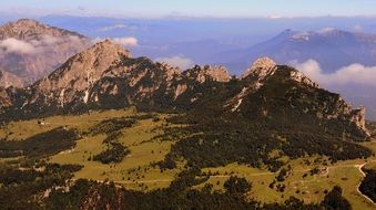 panoramic view of a green plateau in the mountains of italy