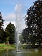 high fountain in the middle of the lake