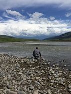 man near the water in yellowstone national park