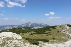 photo of green mountains covered with snow in Austria