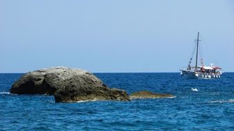 touristic boat near kastro in skiathos on a sunny day