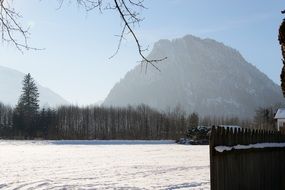 Snow Alpine Mountains in a haze on a sunny day