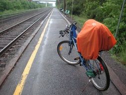 bike is parked at the train station