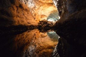 Beautiful and colorful cave with water in light