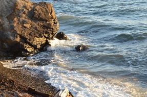 Beautiful and colorful ocean beach with rocks and waves