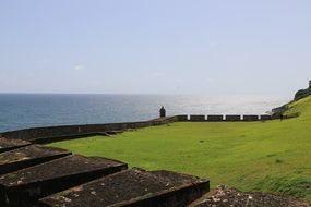 photo of the fortification along the sea coast on a sunny day