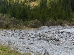 stone riverside with cairns