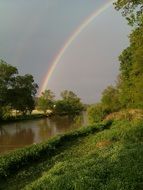 rainbow over the river in the sun