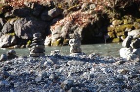 piles of stones at Hiking path along River