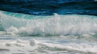 curly sea waves with white foam