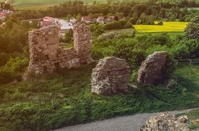 aerial view of castle ruins near a village