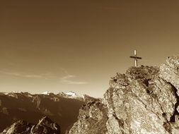 black white photo of a cross on top of the Zillertal Alps