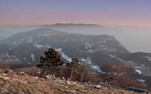 landscape of mountain road amid fog in Slovenia