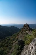 panoramic view of rocks in green trees