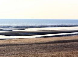 Sand on the beach on the horizon