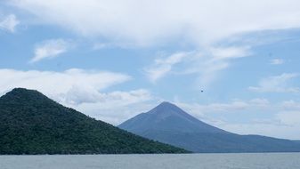 remote view of volcanoes near a lake in nicaragua