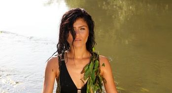 girl in a black bathing suit in the water