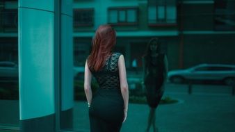 Girl in black dress From The Back view