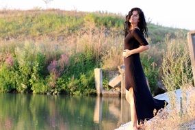 sensual brunette near the water