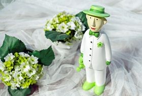 two bouquets and a gardener figurine