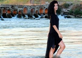 brunette standing in the water