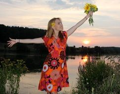 blonde with flowers at sunset