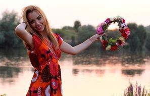 pretty model with flower wreath in hand