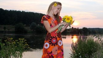 Blonde Girl with Sunflowers Lake sunset view