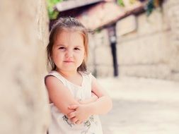 portrait of a little girl in a light dress