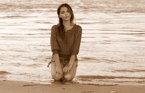 pretty lady on the beach in the evening