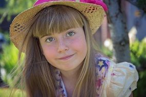 cute girl with blonde hair and hat on it