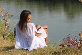 beautiful brunette by the lake