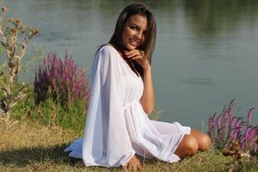 smiling brunette by the lake