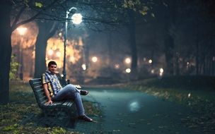 man sitting on a park bench