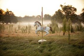 Colorful Carousel Princess Horse on the coast among the plants