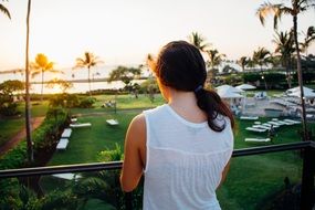 girl in white dress on the balcony