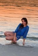 beautiful brunette on the evening beach