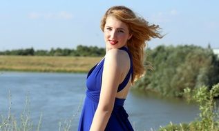 blonde woman in blue dress