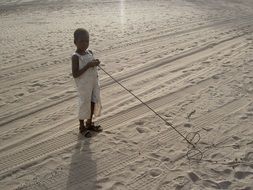 Child with Toy in the Desert