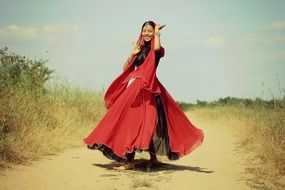 beautiful Hindu is dancing in red dress