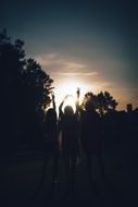 Silhouettes of the girls and sunset