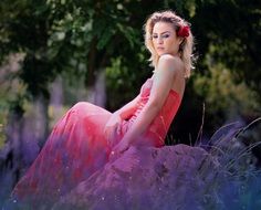 photo of a girl in a pink dress on a lavender field